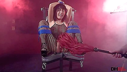 Asian babe is fucked in her hairy pussy by a dildo