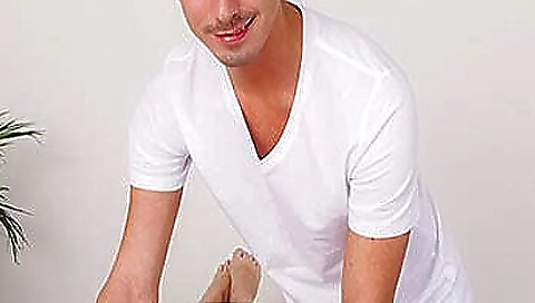 Masseur is taking care of his clients body in the office