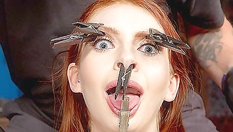 Busty redhead girl demonstrates her tits and booty