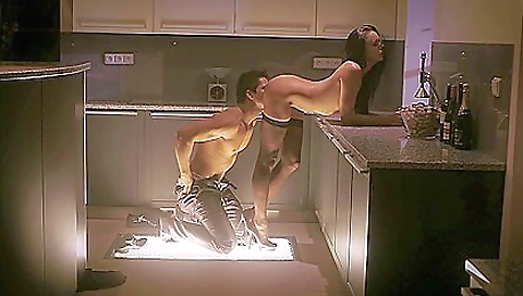 Brightly sexy brunette babe naked in bed in stockings