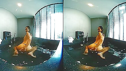 Asian teen in pink bikini doing a good job in the shower