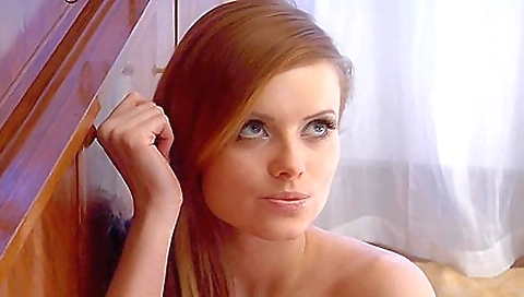 Sexy redhead with a nice figure rides her boyfriend's cock