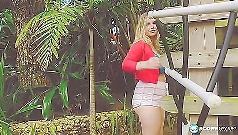 A sexy solo blonde enjoys riding her bike outdoors