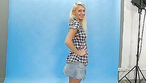 Young blonde stripper wearing bikini shows sexy body