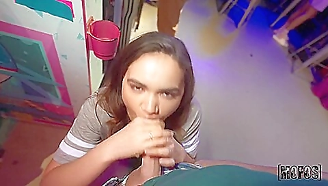 Tattooed woman with a big cock is standing in front